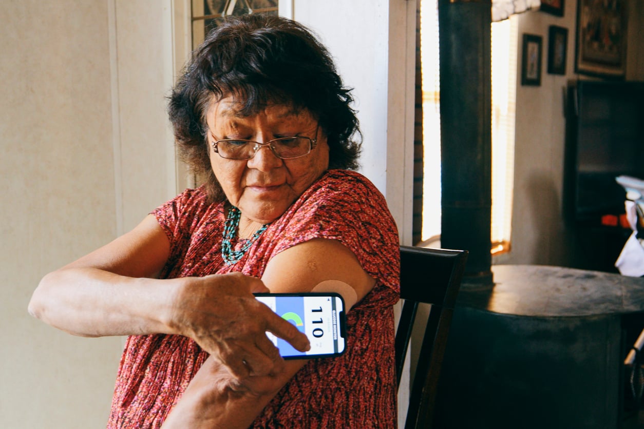 senior managing their diabetes with a cgm